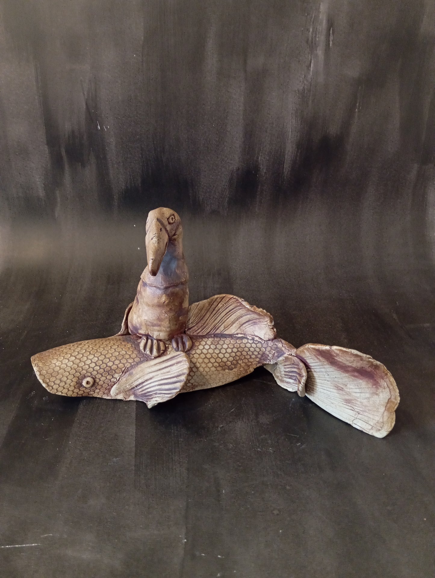 Bird Sitting On A Koi Fish